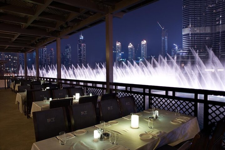 Savor a unique dining experience as you enjoy the stunning views of the Dubai Fountain's choreographed display framed by the majestic Burj Khalifa against a mesmerizing night sky.